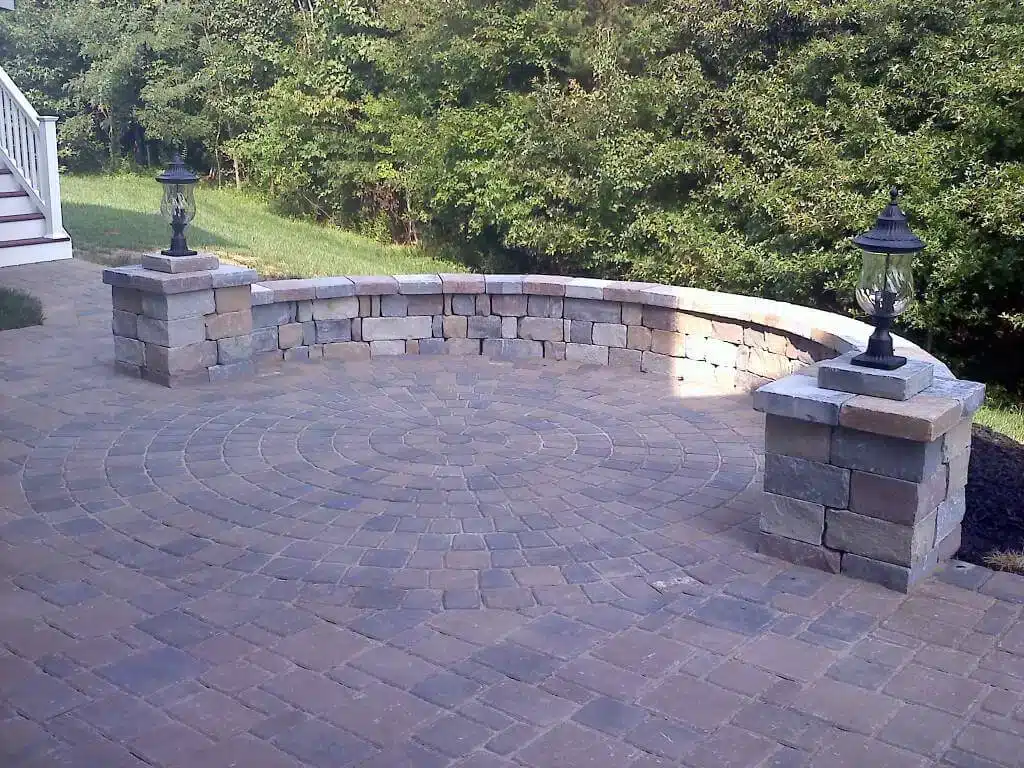 photo of a stone patio with curved seating wall - Patio Design Services and Hardscaping contractors near me in bowie MD